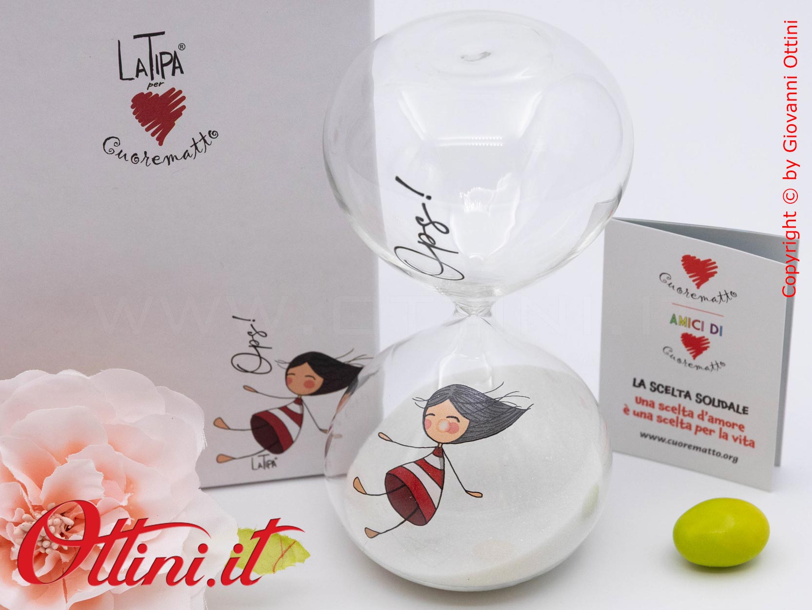 DC004 - La Clessidra 15 Minuti La Tipa di Cuorematto in vetro borosilicato è una bomboniera solidale giovane che sostiene i Frati dell'Antoniano di Bologna.